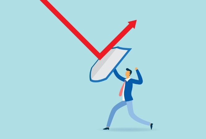 illustration of a businessman deflecting a downward trending stock line with a shield