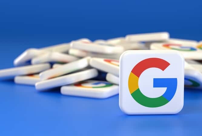 Logos of the company Google in a heap with one tile standing upright in front