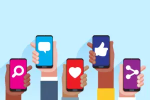 digital illustration of various hands with different skin tones, each holding up a smartphone with a different social media-related icon on the screen