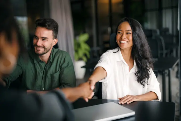 business owners meeting with advertising agency