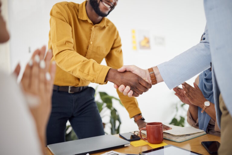 man shaking hands with agency partner