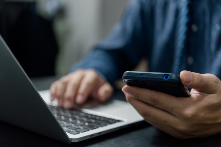user searching on phone and computer